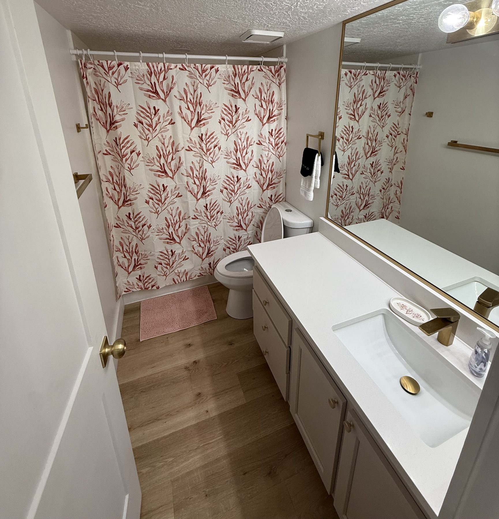 Renovated bathroom with brass fixtures